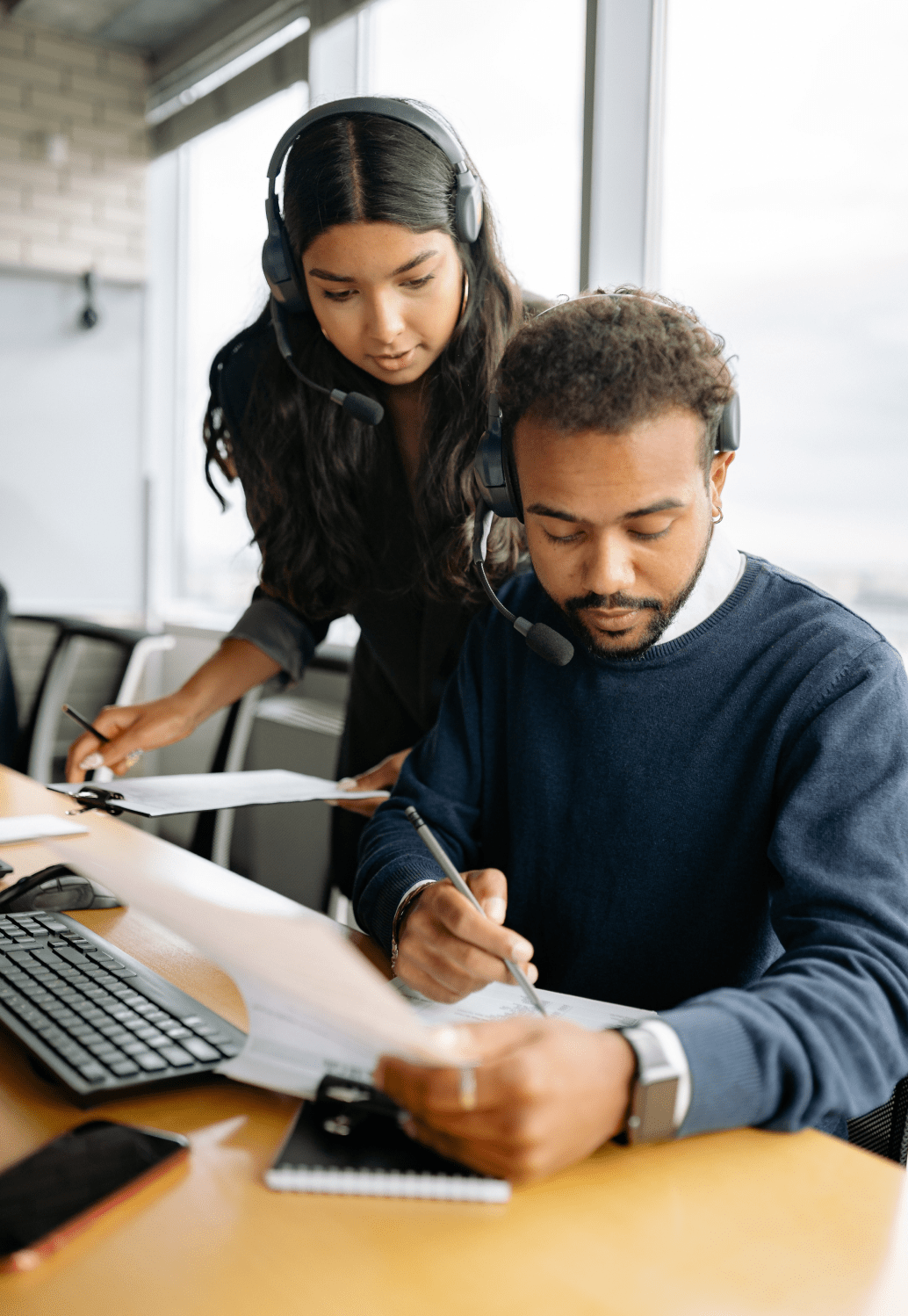 2 People working using Pen and Paper