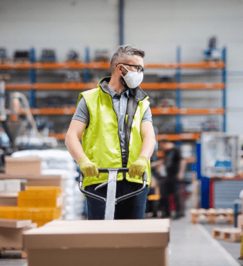 Worker moving a box