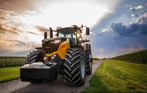 Tractor transporting a load in a field